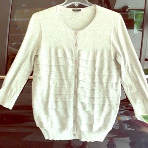 Light gray cardigan.